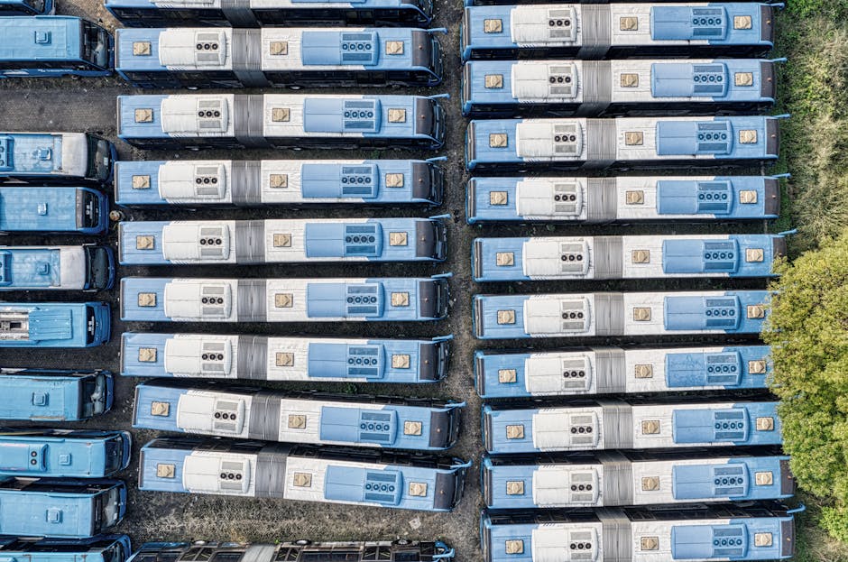 Top-down aerial view of neatly parked blue buses, South Tangerang.